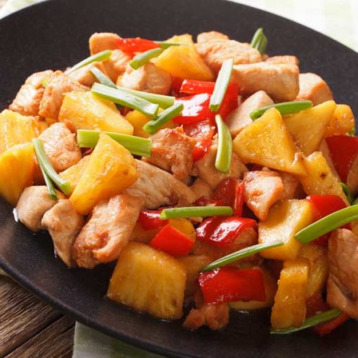 Sweet and sour chicken, pictured with mixed vegetables.